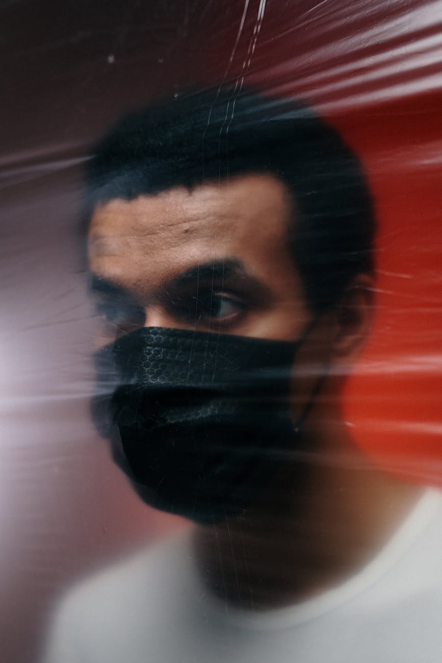 man wearing a black face mask